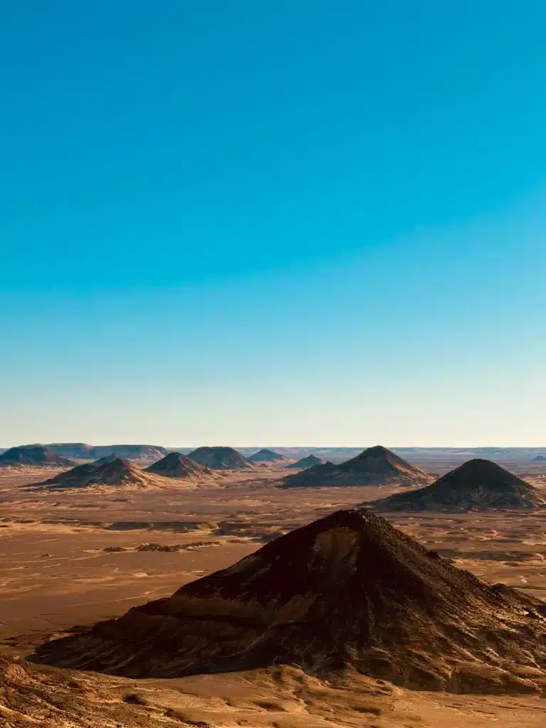 Panorama of the Black Desert volcanic hills near Bahariya Oasis on the eclipse tour
