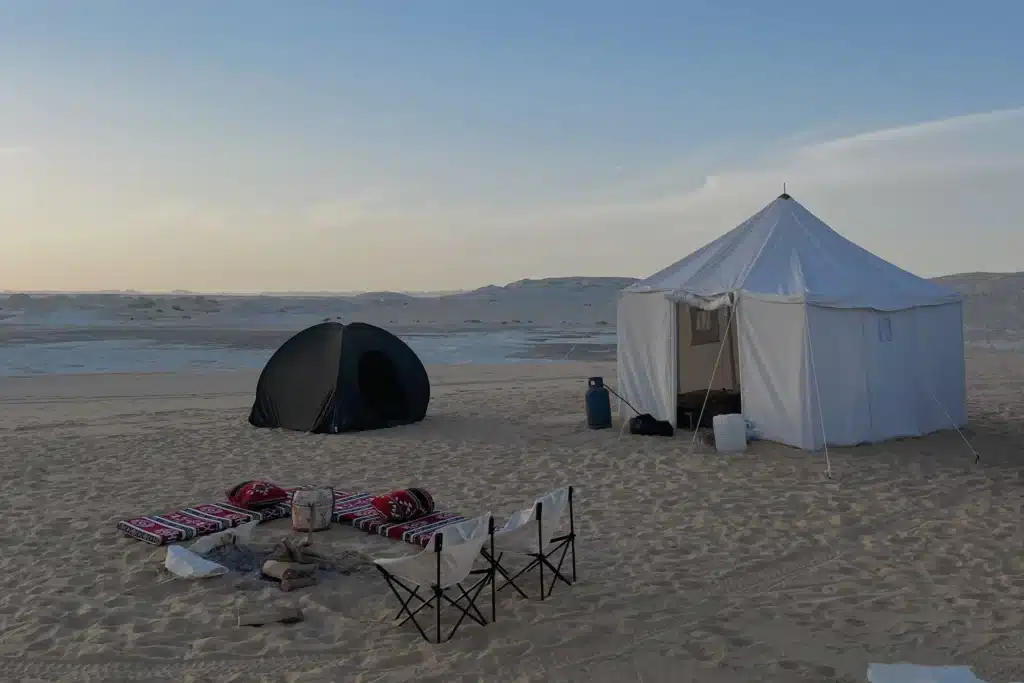 Sleeping bags and a communal tent provided at camp