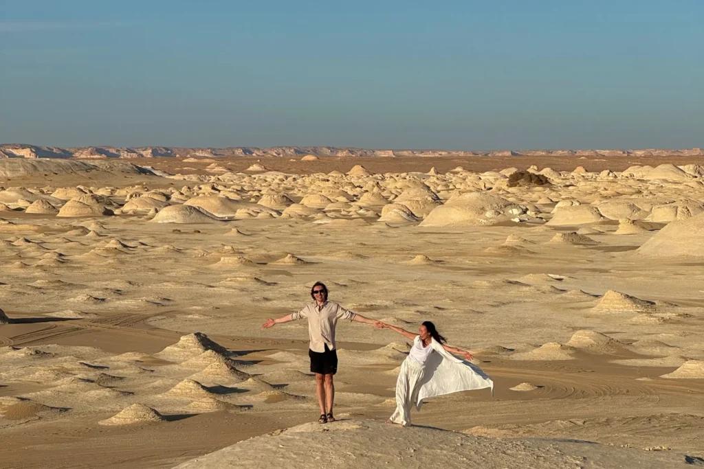 Travelers at a panoramic White Desert viewpoint