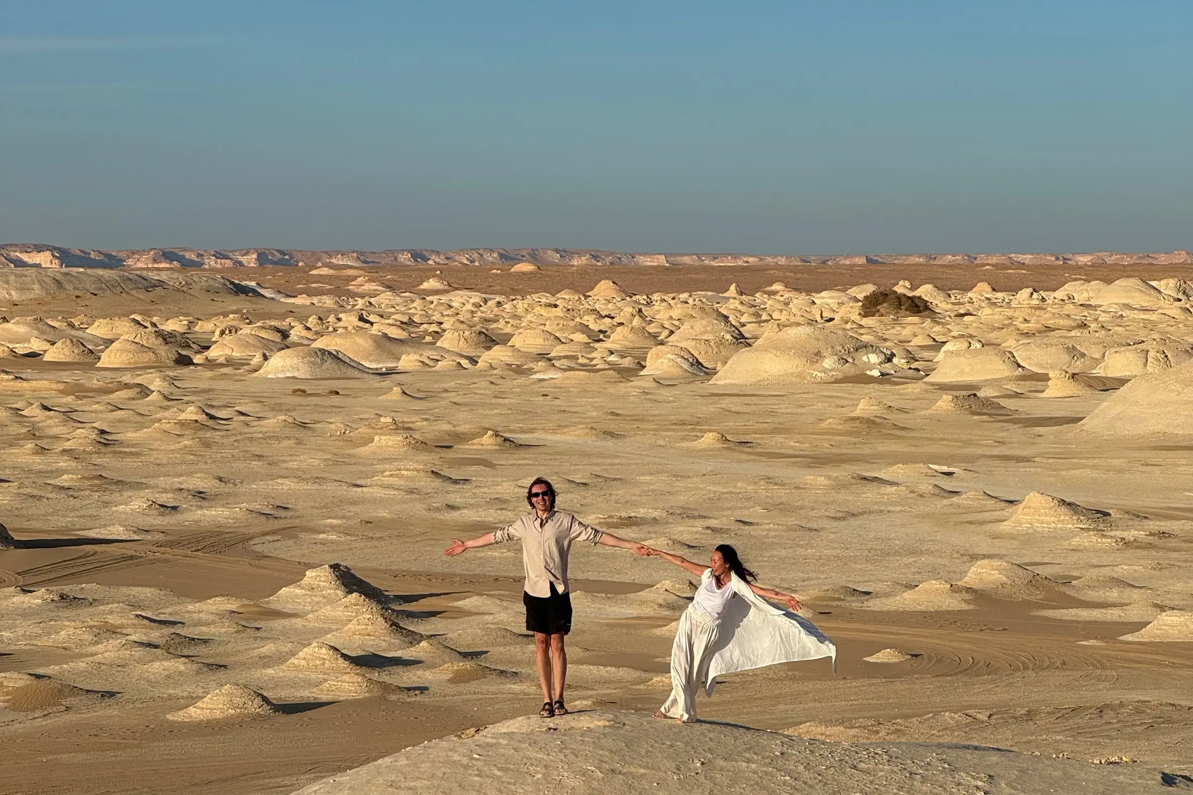 Travelers at a panoramic White Desert viewpoint