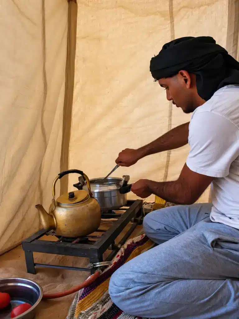 Bedouin tea and dinner being prepared at a desert camp in Egypt